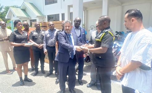 Mohammed Baakbaki, Lebanese Ambassador, handing over the keys to the vehicles to IGP Christian Tetteh Yohuno (2nd from right) while Mohammed Raii (right) looks on