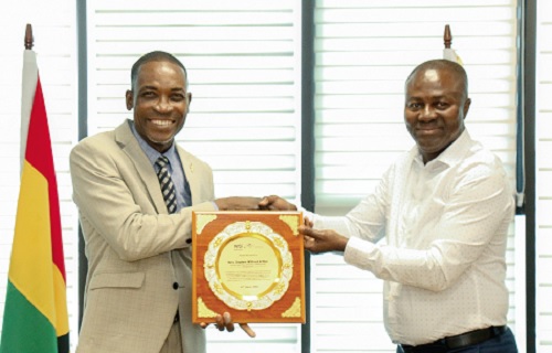 Rev. Stephen Wilfred Arthur (left) receiving the award from Charles Opoku Appiah, President of the local chapter of IFATCA