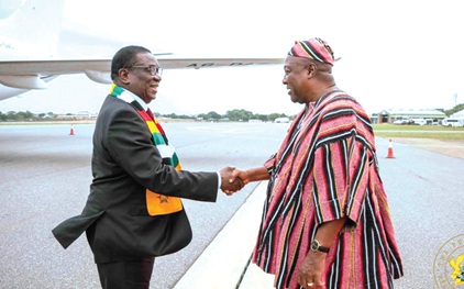 President Mahama (right) welcoming President Emmerson Dambudzo of Zimbabwe, at the Accra International Airport 