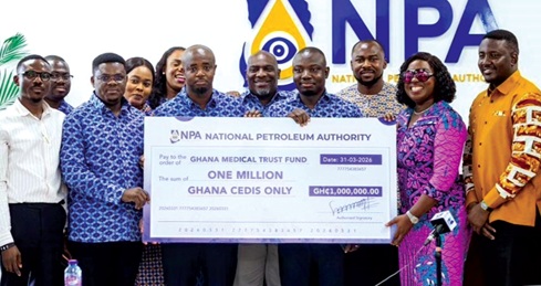 Obuobia Darko-Opoku (2nd from right), Administrator of MahamaCares Fund, and her team receiving the dummy cheque from Godwin Edudzi Tameklo (3rd from left), CEO of NPA, together with his staff