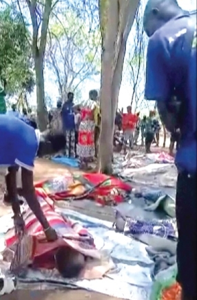  Dead bodies covered on the ground after gunmen killed more than 70 people in South Sudan