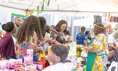Staff and customers briskly sampling Ghana-made products at the bazaar