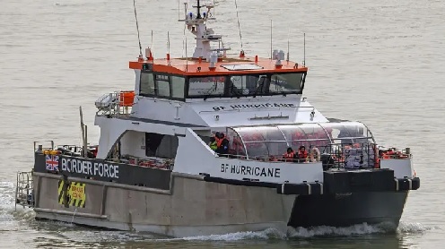 Border Force pictured escorting migrants to the UK after being rescued in the Channel in March