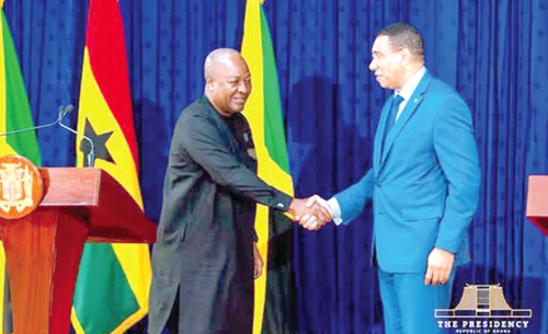 President Mahama (left) exchanging pleasantries with Andrew Michael Holness, Jamaican Prime Minister, after the media briefing