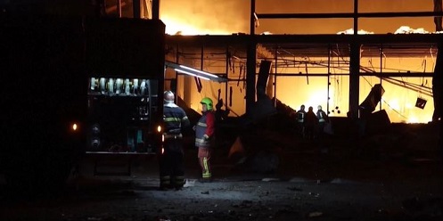 Firefighters battle huge flames in Kyiv region after Russian strikes