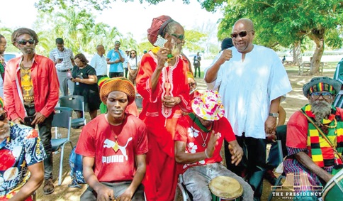 President John Dramani Mahama (arrowed) with Jamaican traditional drummers during a visit to the Seville Heritage Park in St. Ann, Jamaica
