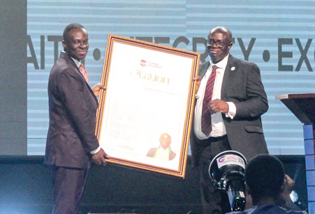 Prof. Samuel Kwasi Dartey-Baah (left), Vice-Chancellor, Central University, presenting a citation to Justice Dennis Dominic Adjei, Supreme Court and AfCHPR Judge. Picture: ERNEST KODZI