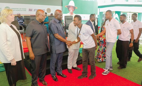 Eric Opoku (3rd from left), Minister for Food and Agriculture, joins Paul Siameh (2nd from left), Chief Director, Ministry of Food and Agriculture, and Elena Pakina (left), Director, Agrobiotechnology Department, Agrarian and Technological Institute, in  congratulating the graduates. Picture: ELVIS NII NOI DOWUONA 