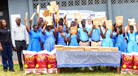 SMT Ghana team, including Amaury Lescaux (middle) and Hilda Peasah (left), with the students displaying the braille sheets