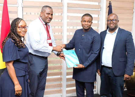 Franklin Sowa (2nd from left), Director, Marketing and Sales, GCGL; presenting the report to Benjamin Avornyotse, acting Director for Communications, International Cooperation and Strategic Partnerships, Cyber Security Authority. Looking on are Linda Aryee (left), Manager, Marketing, Corporate and Investment Banking, Stanbic Bank, and Theophilus Botchway (right), Principal Manager of Law Enforcement Liason Unit, Cyber Security Authority. Picture: ELVIS NII NOI DOWUONA 
