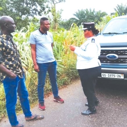 Chief Superintendent Benedicta Akpene Ansah, Volta Regional MTTD Commander explaining a point to two occupants of vehicles intercepted during the exercise