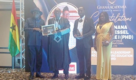 Nana Francis Essel Okyeahene  (2nd from left) receiving the award