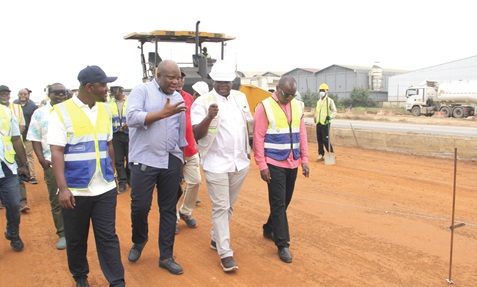 Alhaji Ali Seidu (2nd from left), the Founder of Maripoma Enterprise Limited, taking  Governs Kwame Agbodza (2nd from right), Minister of Roads and Highways, his deputy, Alhassan Sayibu Suhuyini (left), and other dignitaries round to inspect the progress of work on the Accra-Tema Motorway project. Picture: Nana Konadu Agyeman