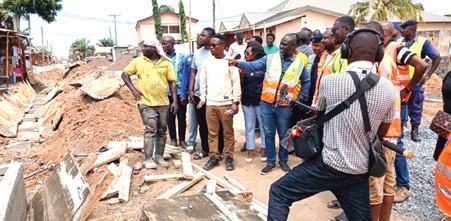 Dr Ernest Henry Norgbey, MP for Ashaiman; Freeman Tsekpo, MCE for Ashaiman, and other stakeholders inspecting ongoing road and drainage projects in the municipality