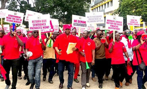 Abdul Moomin, General Secretary of Ghana Mineworkers' Union, addressing NEC members at the forecourt of the TUC prior to the protest and presentation of petitions to BOG, Ministries of Finance, and Lands and Natural Resources