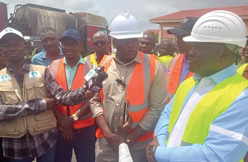 Kwame Governs Agbodza (middle), Minister of Roads and Highways, speaking to the media after inspecting the ongoing road construction leading to the Sewua Hospital. Looking on is Dr Frank Amoakohene (right), Ashanti Regional Minister