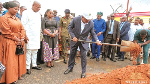 President John Dramani Mahama cutting the sod for the construction of a multi-purpose, multi-tiered car park and airport hotels complex at the Accra International Airport. Looking on are Joseph Bukari Nikpe (2nd from left), Minister of Transport; Yvonne Nana Afriyie Opare (3rd from left),  Managing Director of the Ghana Airports Company Limited, and other dignitaries