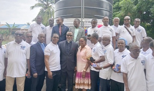 Very Rev. Kofi Agyekum-Agyen (arrowed), Superintendent Minister of the Kaneshie North Circuit of the Methodist Church Ghana, with members of the Men’s Fellowship by the 10,000-litre Polytank connected to the mechanised borehole