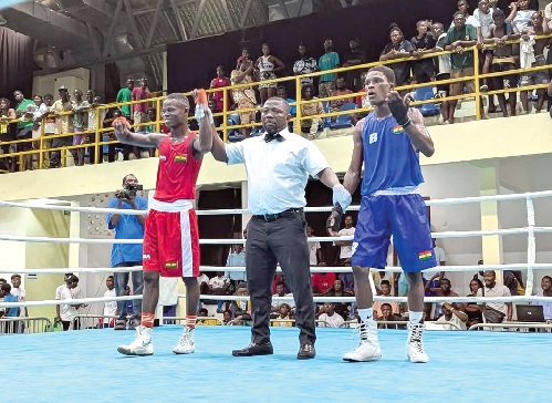 • Amadu Mohammed is declared winner of his semi-final clash with James Armah (right)