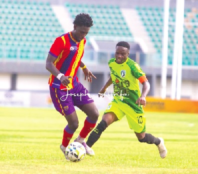 ­­David Oppong Afrane of Hearts of Oak gains control of the ball during a tussle with Bechem United skipper, Augustine Okrah, during yesterday’s game
