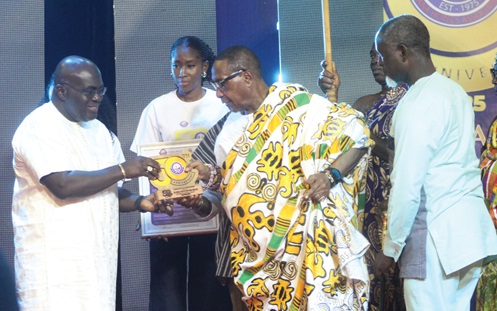Nene Nagai Kassa VIII (right), Chief  of Agomeda, Shai Traditional Area, receiving his award from Julius Debrah