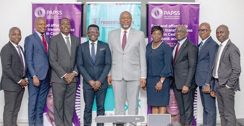 Ebow Quayson (3rd from left), acting Managing Director of Prudential Bank, with Mike Ogbalu III (middle), CEO, Pan-African Payment and Settlement System, and other officers of the bank and PAPSS after the visit