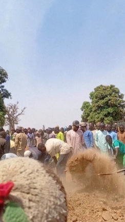 People dig graves with shovels after a deadly attack by an armed gang in Katsina, Nigeria, February 4, 2026, in this screengrab from video. Reuters TV/via REUTERS