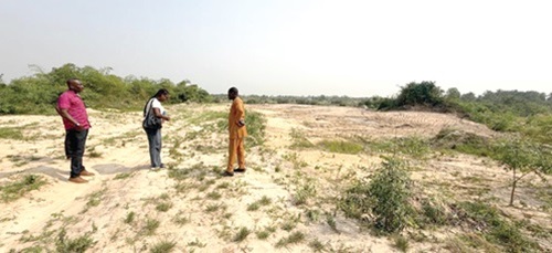 Maxwell Klu (right), Deputy CEO, Minerals Commission, at one of the reclaimed sites
