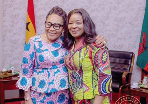 Lordina Dramani Mahama (left) and Mutinta Hichilema, First Lady of Zambia, in a warm hug during the visit