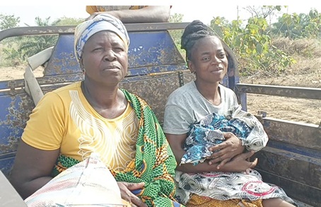  Cynthia Ndoonbi (right) on her way to the hospital after delivering the twins