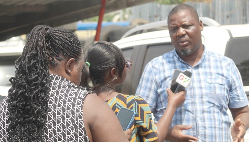 Kweku Bernard (right), Chairman of the East Legon Hills Water Utility Committee, addressing the media after the meeting. Picture: ESTHER ADJORKOR ADJEI  