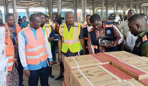 Prof. John G. Gatsi (3rd from left), Board Chairman, being briefed by inspectors of the Energy Commission at the Tema Port on their operations