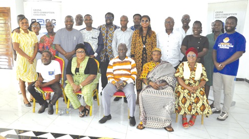 Mohamed Avona (seated middle), Volta Regional Coordinating Director, with some of the participants