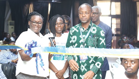 Dr Emma Donkor, HOD, Fashion and Textiles, ATU, cutting a ribbon to open an exhibition at the 3rd ATU library week celebration. With her is Mark Brookman Amissah, Vice Dean, Faculty of Built Environment, and Dr Florence Plockey (middle), ATU Liberian. Picture: BENEDICT OBUOBI