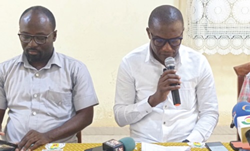 Dr Josephat A. Nyuzaghl (right), Upper West Regional Director of Health Services, addressing the media