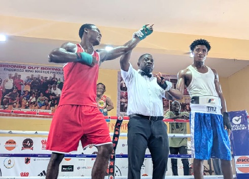 •Issah Okine (left) on cloud nine  after being declared winner against Rafael Lokko
