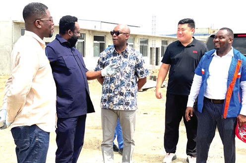 Dr Hugh C.A. Brown (middle), Chief Executive Officer of the Forestry Commission, Elikem Kotoko (left), Deputy Chief Executive Officer, Forestry Commission, in a discussion with staff of West Coast Wood Products during a working visit to the Afienya plywood factory