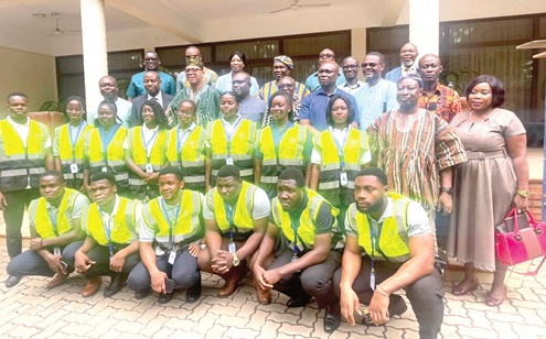 Adam Mutawakilu (arrowed), Managing Director of GWL, with the trained national service persons. With them are officials from the GWL
