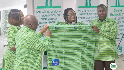 Sylvia Naa Kwakai Nyante (2nd right), Deputy Managing Director (DMD) in charge of Operations, launching the new cloth. Supporting her includes Edward Ato Sarpong (2nd from left), Managing Director, ADB