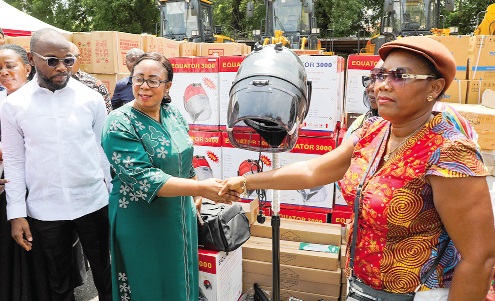 Linda Obenewaa Akweley Ocloo (2nd from left), Greater Accra Regional Minister, presents equipment to Akuyo Brown (right), a beneficiary of the National Apprenticeship Programme, while Osman Ayariga (2nd from right), Chief Executive Officer of the National Youth Authority, looks on. Picture: ELVIS NII NOI DOWUONA 