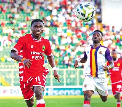 • Asante Kotoko’s Saaka Dauda (left) and Martin Karikari in a hot pursuit of the ball during the game