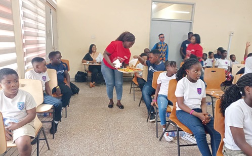 Learners from Bellus Spring Academy   sampling some made-in-Ghana chocolate products during a tour of the facility as part of the National Chocolate Day celebration