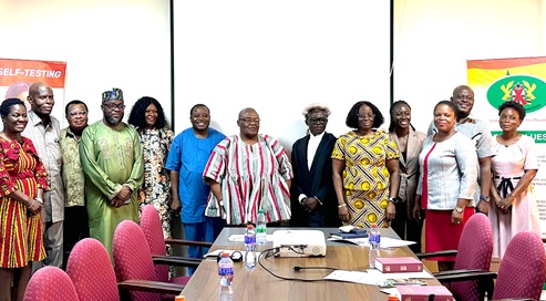 Kakra Essamuah (in smock), Chairperson of the Governing Board of the Ghana AIDS Commission, with the regional committee members after the inauguration