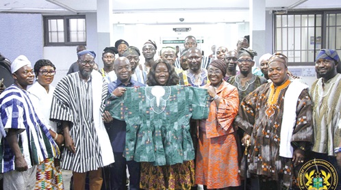 Elizabeth Ofosu-Adjare (displaying fugu), Minister of Trade, Agribusiness and Industry; Sampson Ahi (4th from left), Deputy Minister of Trade, Agribusiness and Industry, and Abla Dzifa Gomashie (3rd from right), Minister of Tourism, Culture and Creative Arts, with some members of the Smock Weavers Association