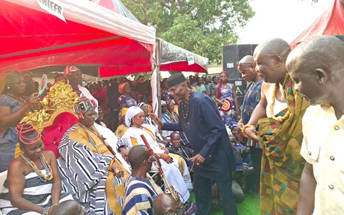 John Kwadwo Gyapong (arrowed), Oti Regional Minister, exchanging pleasantries with Ukpalibor Kofi Bajinpoan  during a durbar held at Kpassa to outdoor him