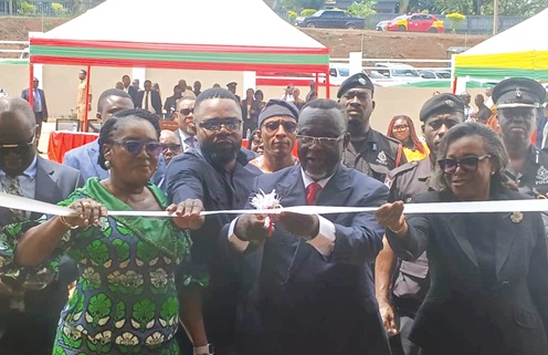 Justice Paul Baffoe-Bonnie (2nd from right), Chief Justice, being assisted by Rita Akosua Adjei Awatey (2nd from left), Eastern Regional Minister, and John Evans Kumordzi (3rd from right), Municipal Chief Executive for Akuapem North, to inaugurate the court building (above)