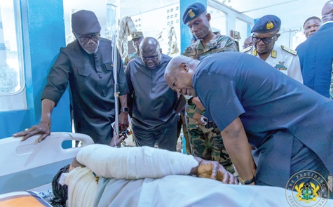 President John Dramani Mahama interacting with one of the Burkina Faso terrorist attack survivors at the 37 Military Hospital