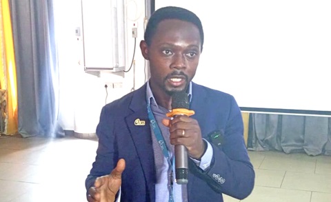 Festus Fofie (left), the Programme Director for Water, Sanitation, and Hygiene at CRS Ghana, addressing participants