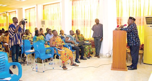 Dr Nii Moi Thompson (right), Chairman  of the National Development Planning Commission, addressing the participants