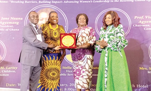 Prof. Naana Jane Opoku-Agyemang (2nd from right), Vice-President, with Nana Oye Bampoe Addo (2nd from left), Deputy Chief of Staff, Administration, Office of the President, receiving a plaque from Prof. Victor Kwame Agyeman (left), Chairman, Public Services Commission